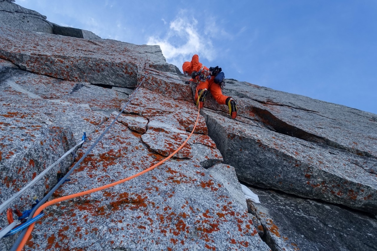 Tom Livingstone forging ahead on a early winter ascent of the British Route on the North East Face of Piz Badile. Photo: Gasper Pintar