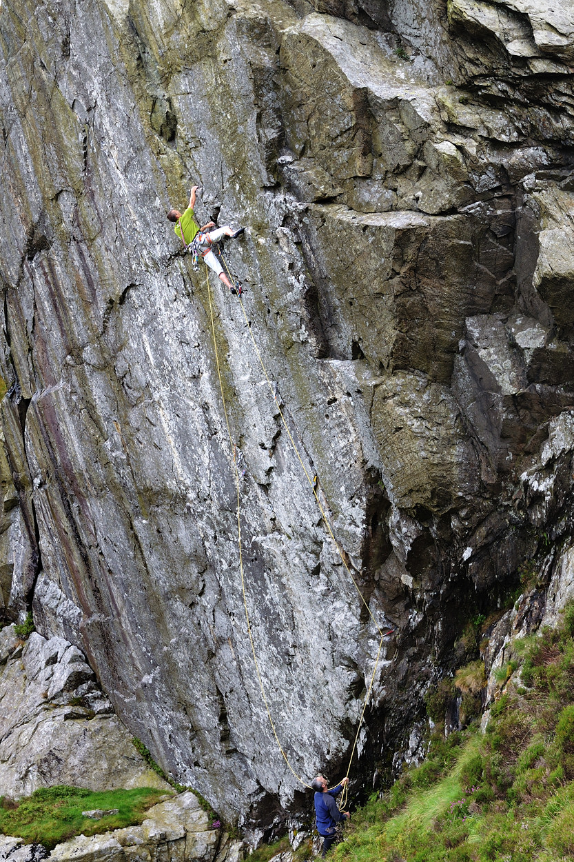 Steve McClure on Heart of Stone (E7 6c);  Mission Impossible (E9 7a) climbs the wall to Steve’s left. Photo: Keith Sharples