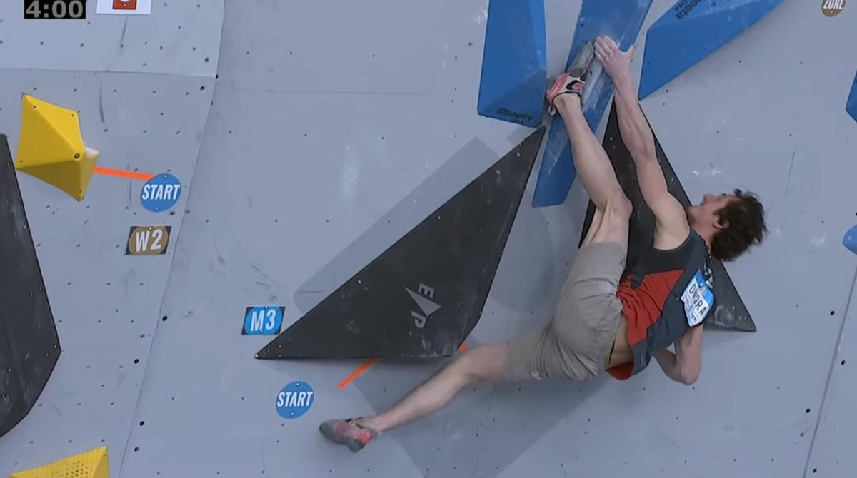 Adam Ondra blending climbing ability, flexibility, strength and route-reading with the only flash of M3.