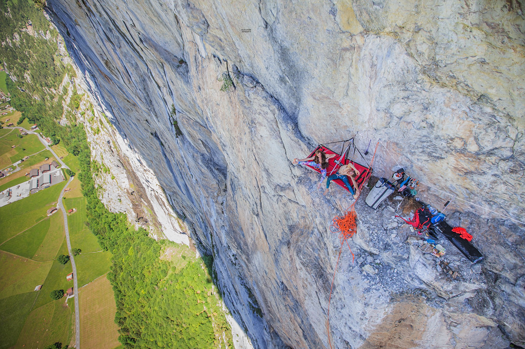 Siebe Vanhee and Sébastien Berthe doing their yoga exercises in style at their portaledge camp 400m of the ground below pitch 17. Photo: Julia Cassou