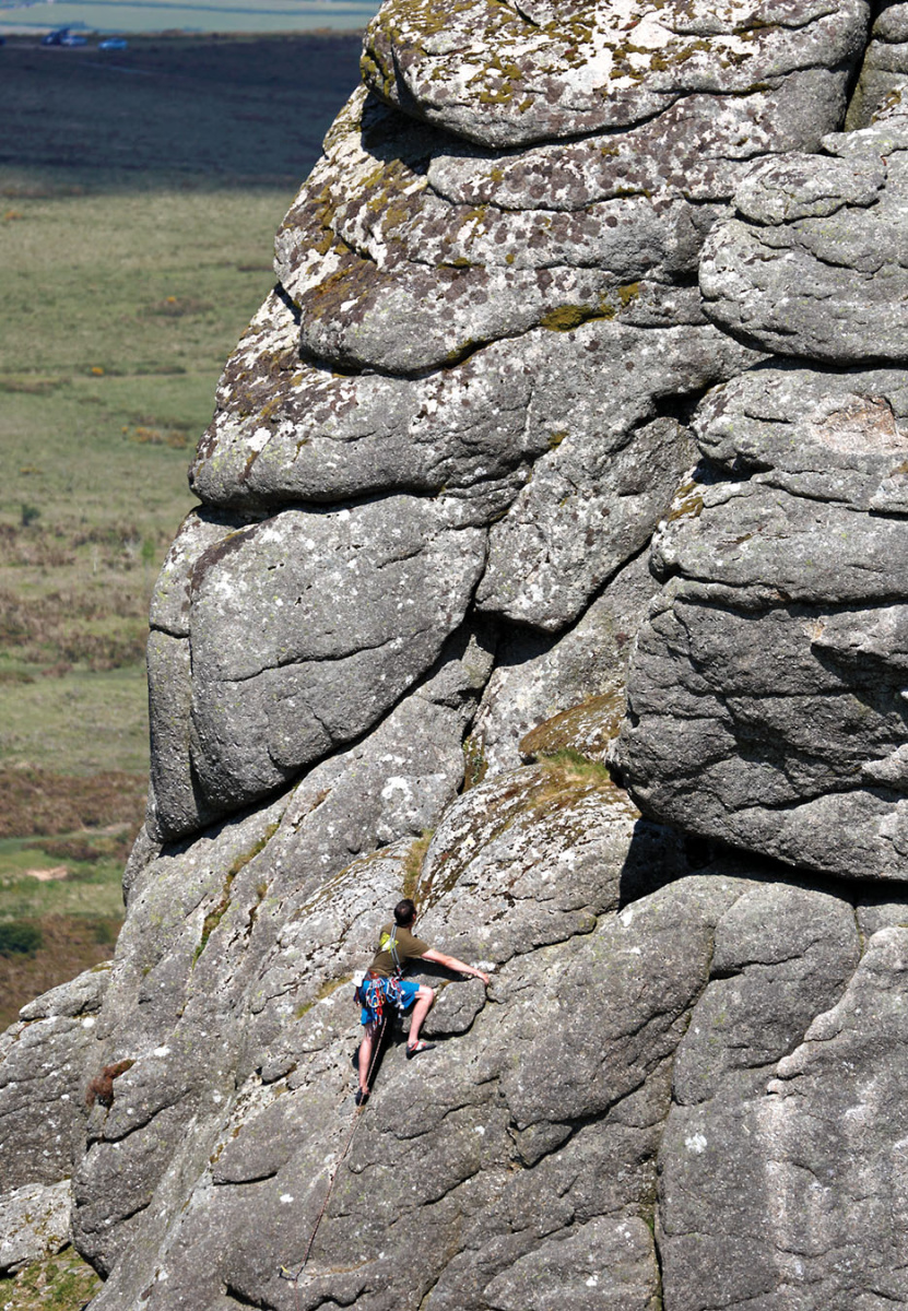 A climber tackles Grey Mare's Groove (D) on the left-hand end of Haytor West Face close to the point where it turns the corner to the North Face. © David Simmonite