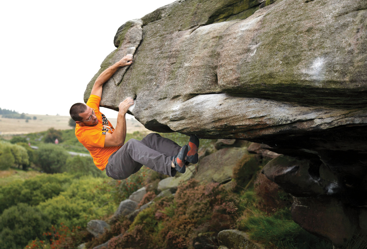 Gareth Parry nears the end of Mark's Roof Original (Font 7A). This long problem is sustained, varied and is without doubt excellent. It climbs the start of Mark's Roof but continues traversing left to finish up Mark's Roof Left-Hand. Photo: © David Simmonite